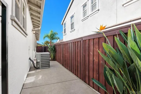a view of a big yard with a large trees