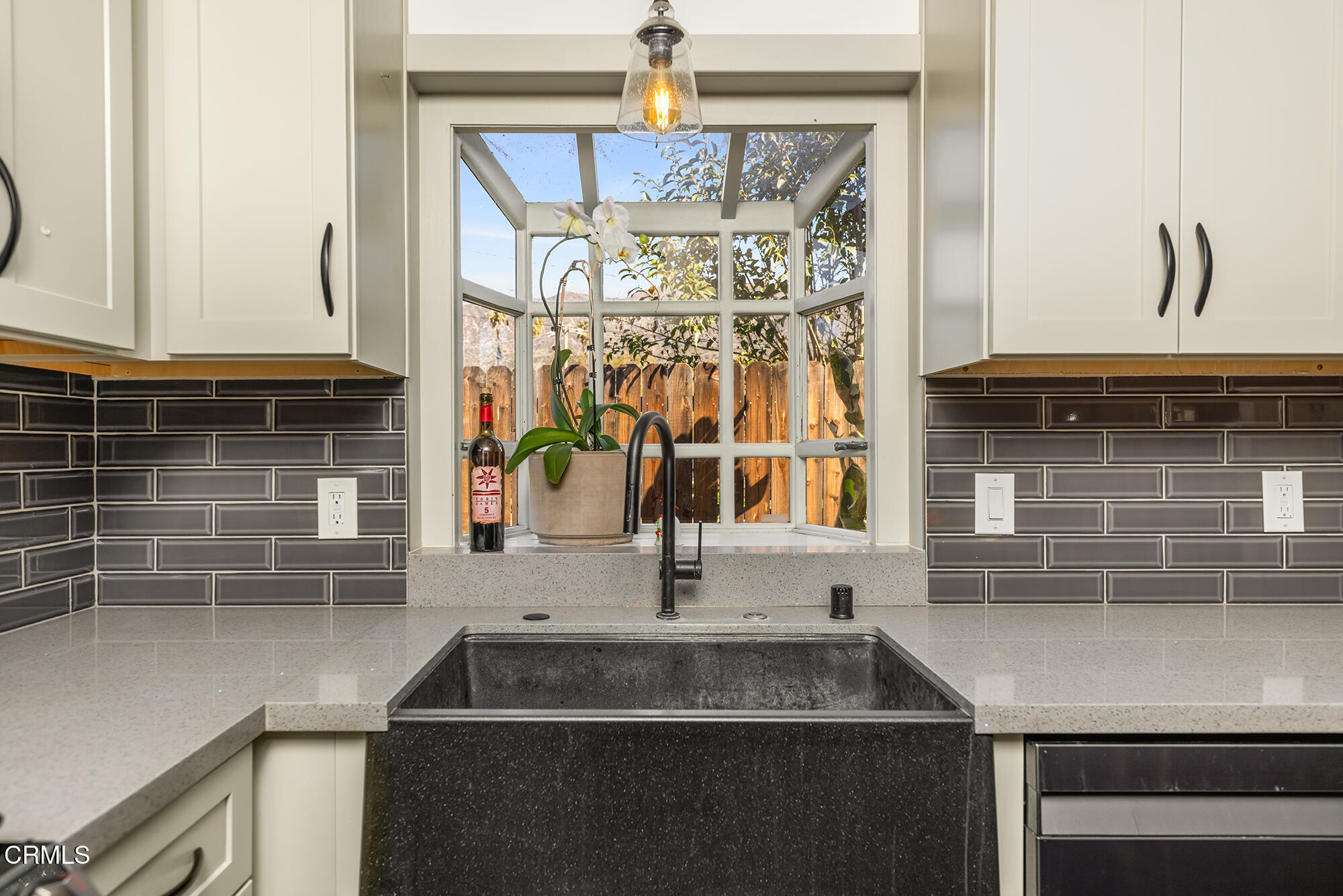 456 North Rice Road Ojai, CA 93023 - Photo 14 of 55 a kitchen with a sink and a mirror