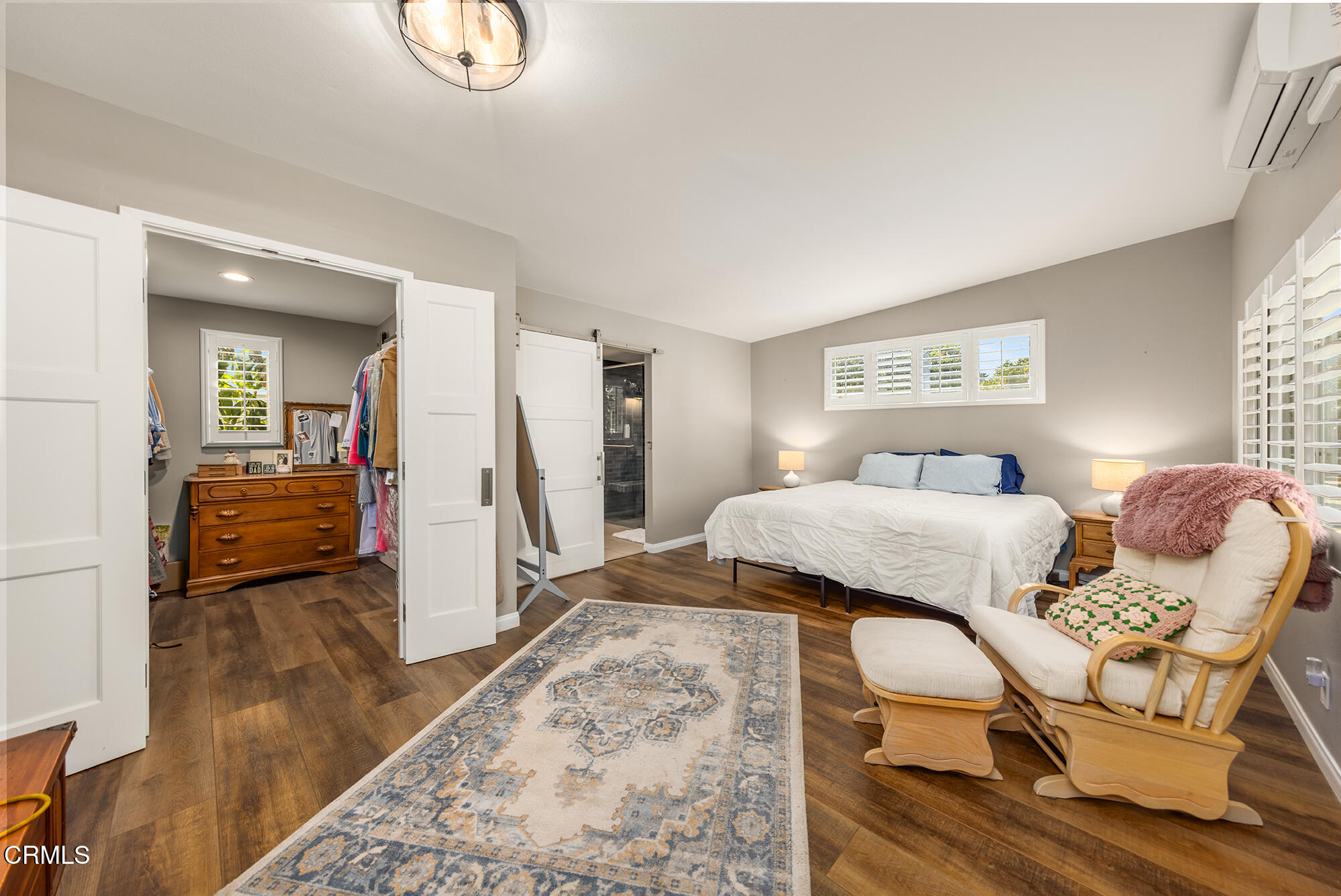 456 North Rice Road Ojai, CA 93023 - Photo 16 of 55 a bedroom with a bed and wooden floor