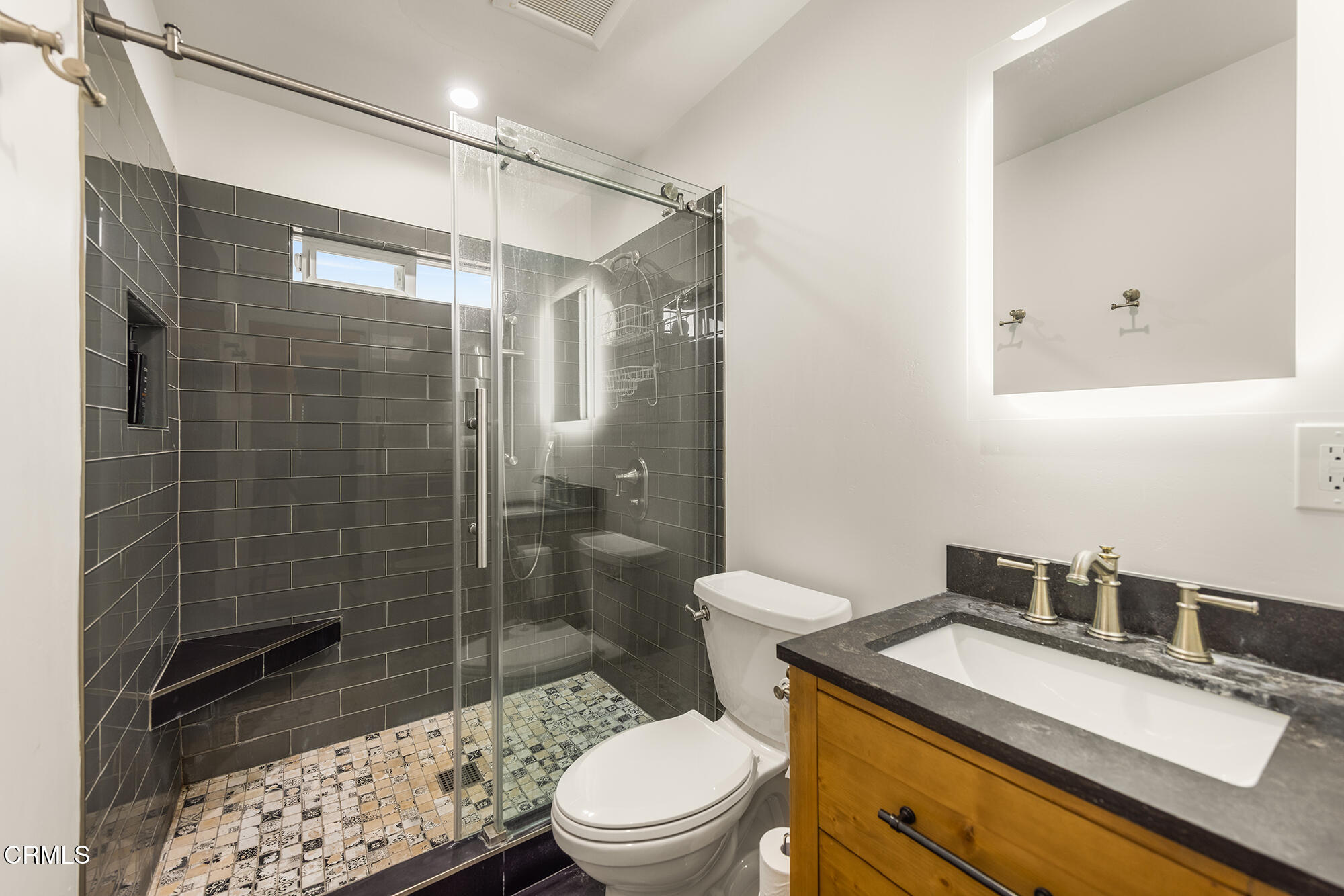 456 North Rice Road Ojai, CA 93023 - Photo 22 of 55 a bathroom with a sink a toilet and shower