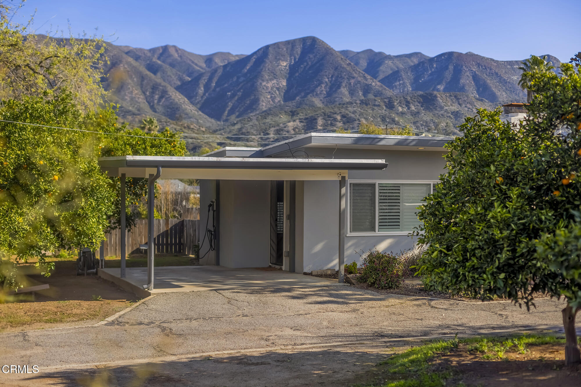 456 North Rice Road Ojai, CA 93023 - Photo 28 of 55 a view of a house with a yard and large tree