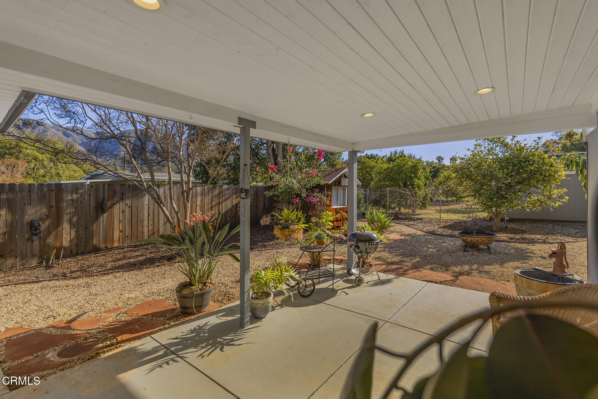 456 North Rice Road Ojai, CA 93023 - Photo 33 of 55 a view of a patio with table and chairs under an umbrella