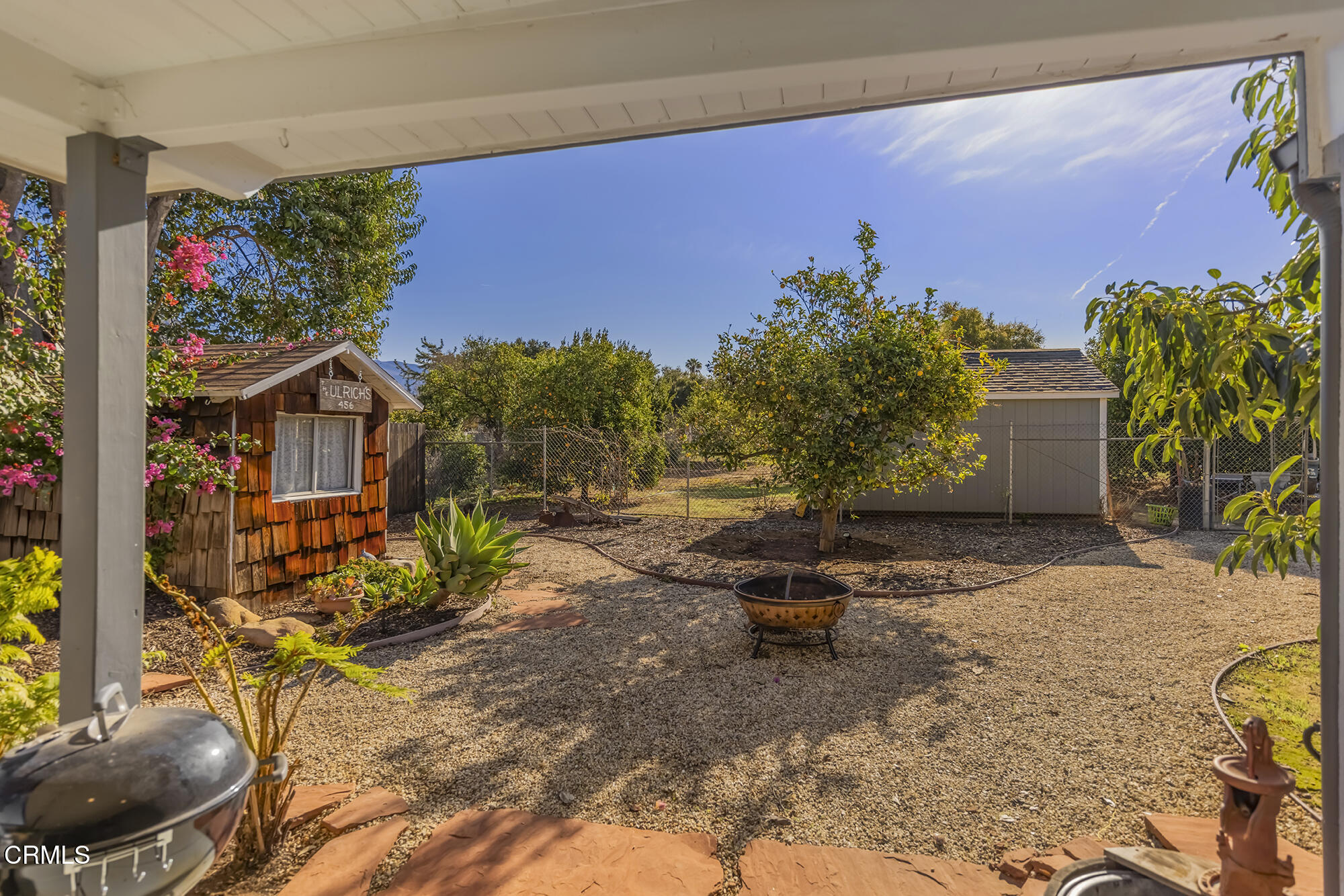 456 North Rice Road Ojai, CA 93023 - Photo 35 of 55 a backyard of a house with table and chairs