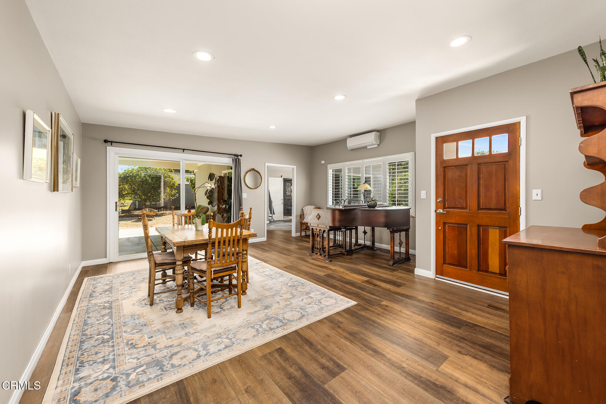 456 North Rice Road Ojai, CA 93023 - Photo 7 of 55 a view of a dining room with furniture a chandelier and wooden floor