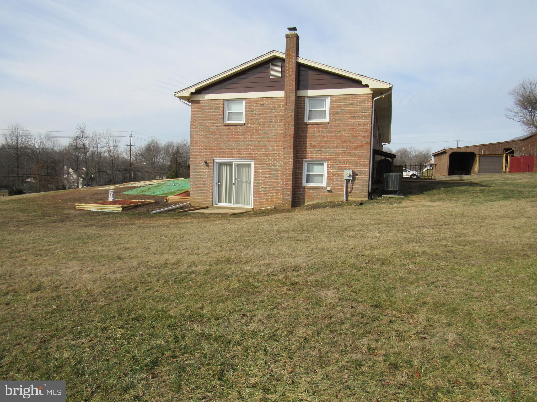 7400 South Osborne Road Upper Marlboro, MD 20772 - Photo 4 of 18 Side view showing walk-out level