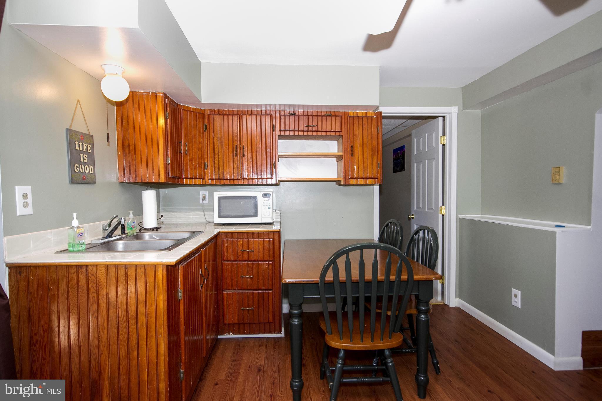 2847 Patapsco Road Finksburg, MD 21048 - Photo 22 of 30 a kitchen with stainless steel appliances a table chairs and a window