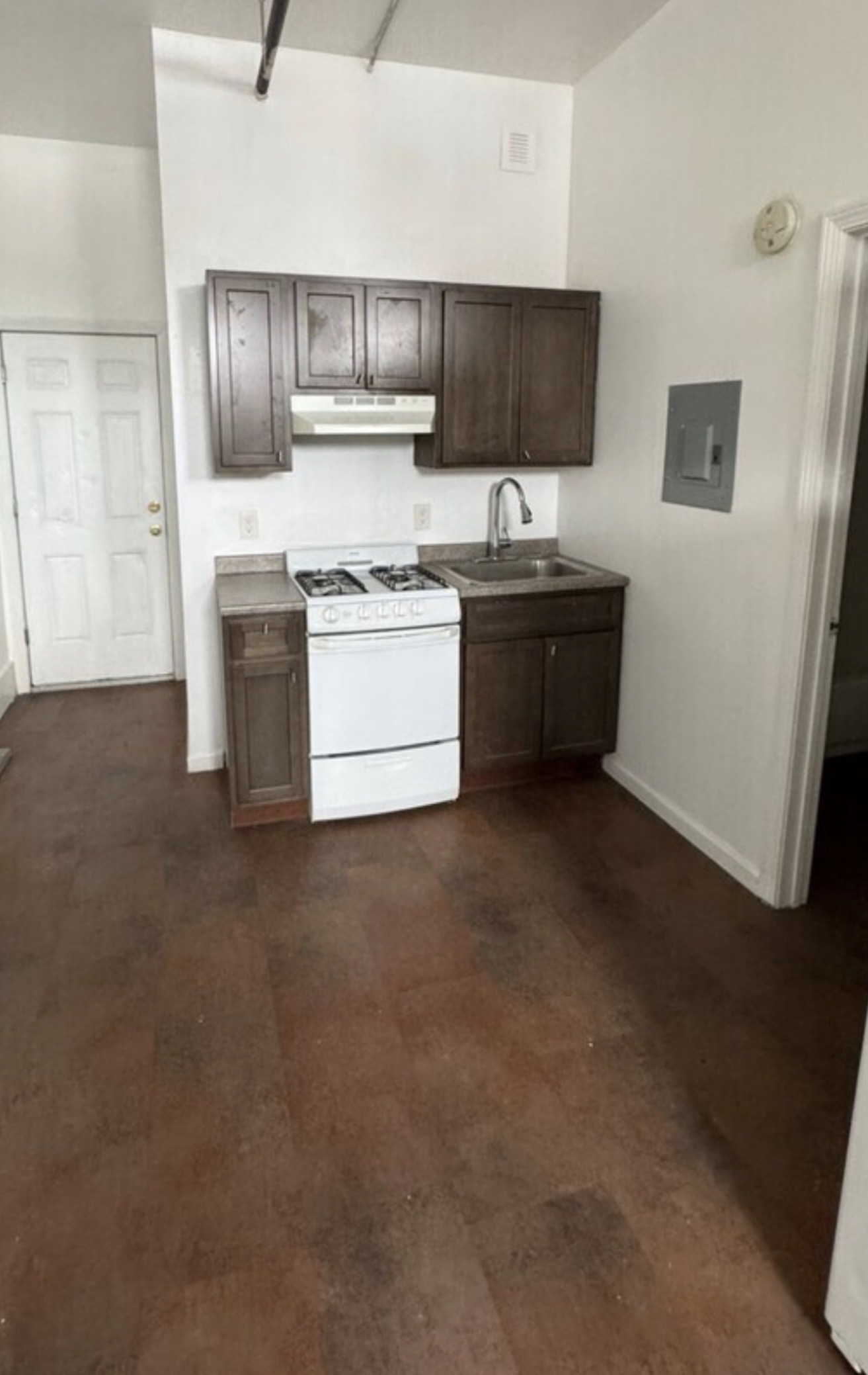 2014 Main Street, Unit 22 Bridgeport, CT 06604 - Photo 1 of 1 a kitchen with stainless steel appliances kitchen island granite countertop a stove a sink and a refrigerator