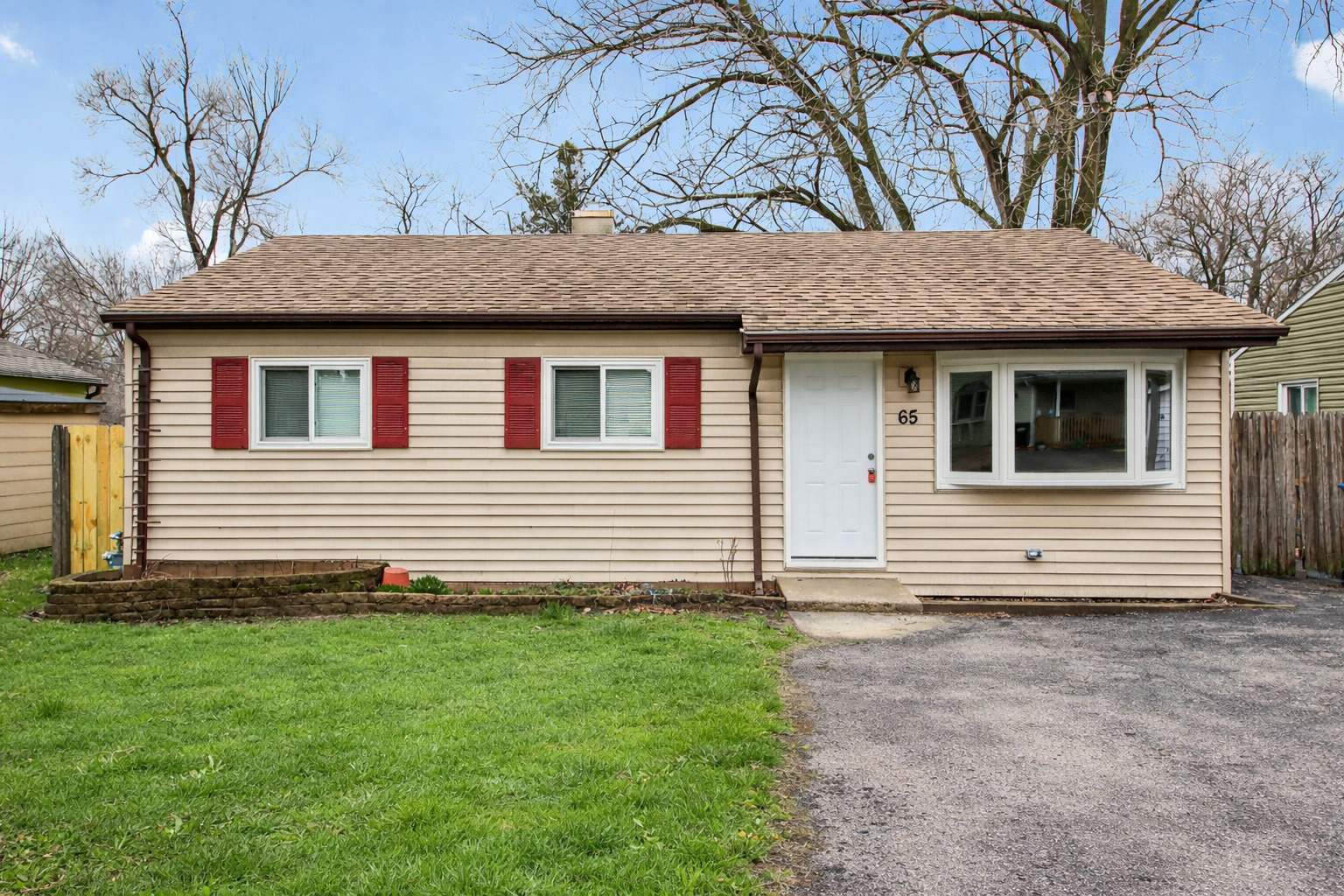 65 Della Street Crystal Lake, IL 60014 - Photo 1 of 28 a house that has a lot of windows on it