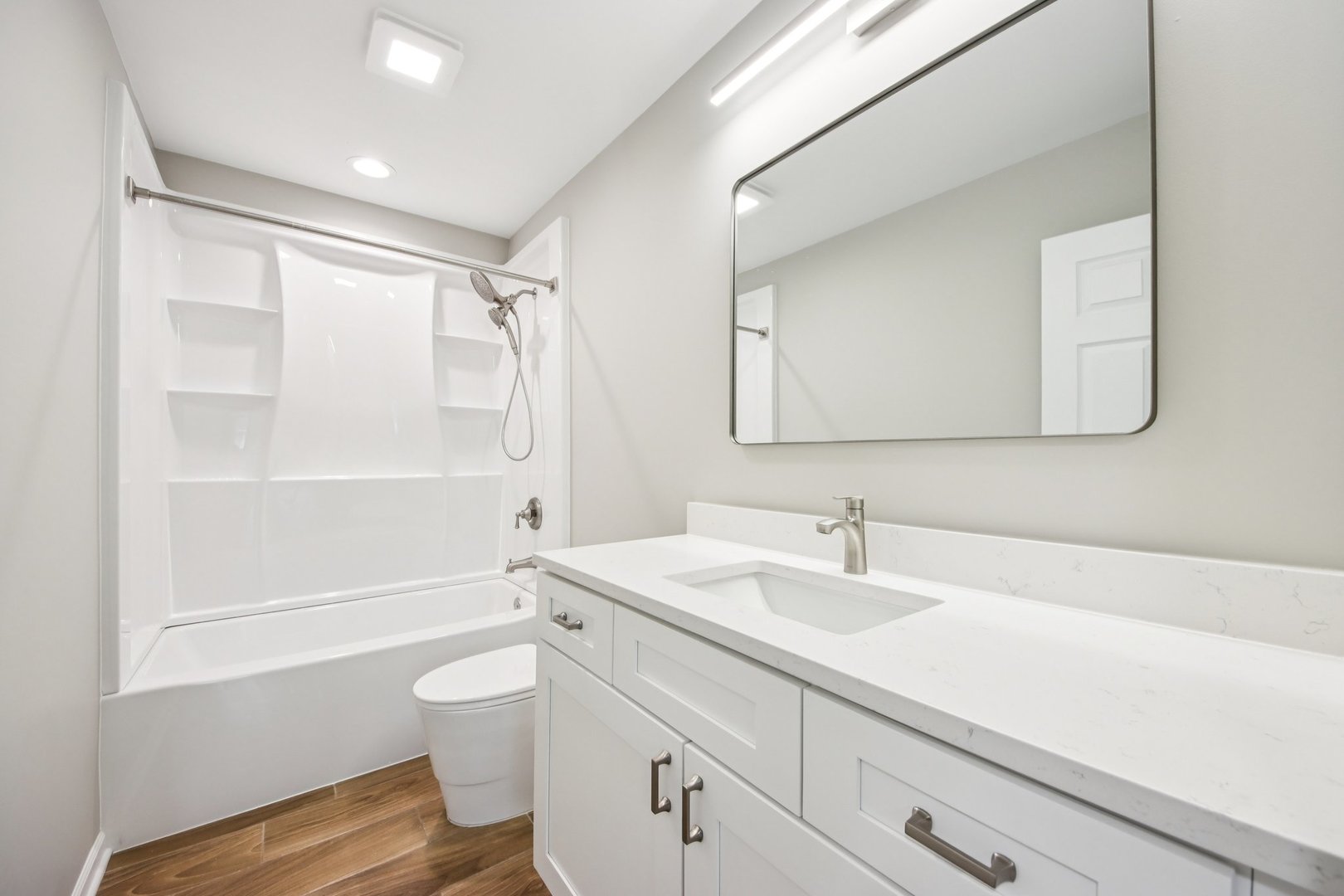 65 Della Street Crystal Lake, IL 60014 - Photo 12 of 28 a bathroom with a sink a toilet and shower