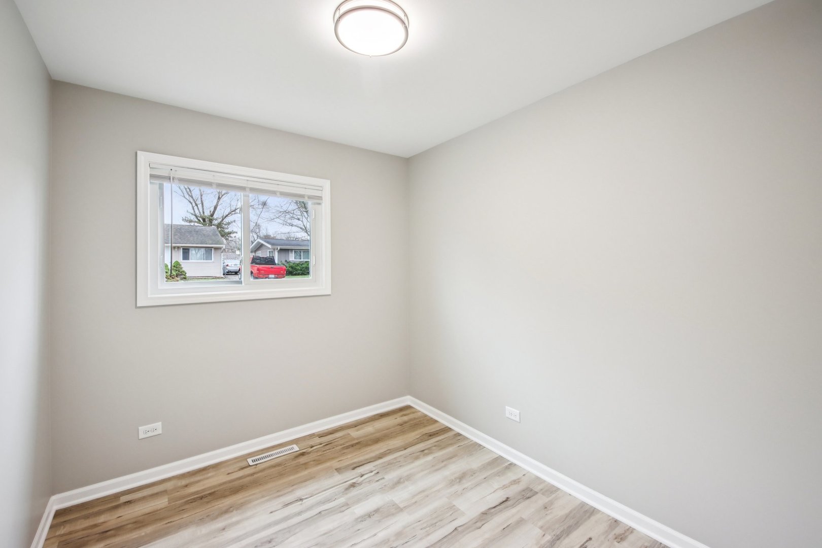 65 Della Street Crystal Lake, IL 60014 - Photo 13 of 28 a view of empty room with wooden floor