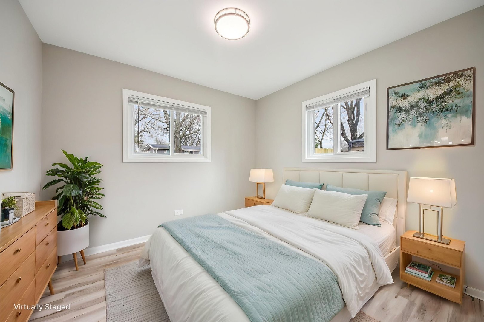 65 Della Street Crystal Lake, IL 60014 - Photo 14 of 28 a bedroom with bed and paintings on the wall