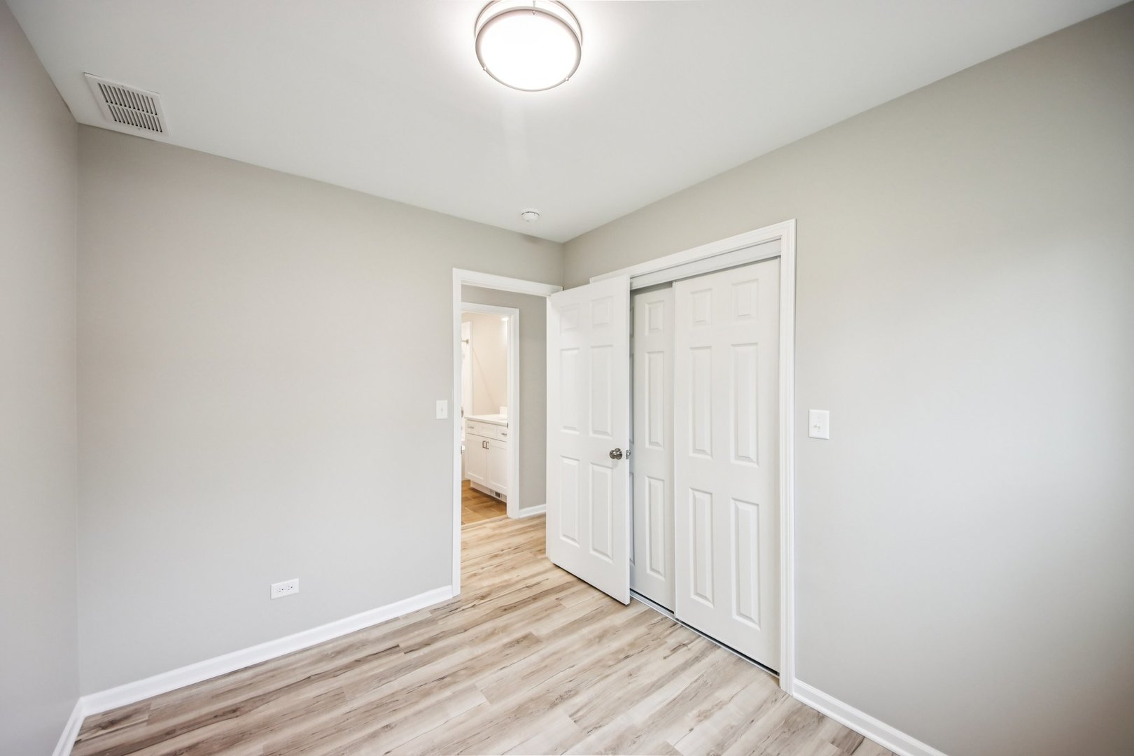 65 Della Street Crystal Lake, IL 60014 - Photo 16 of 28 a view of a room with wooden floor