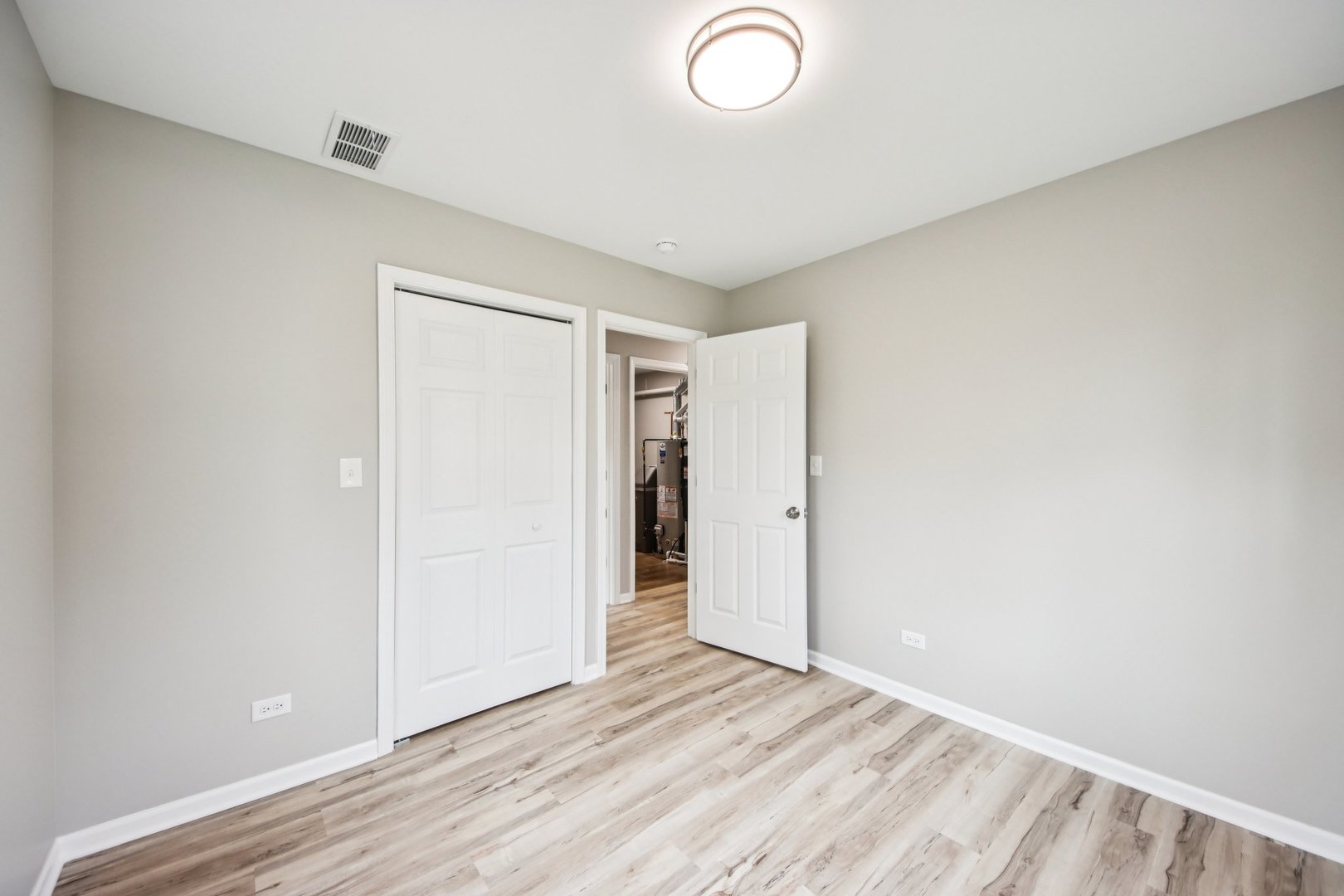 65 Della Street Crystal Lake, IL 60014 - Photo 19 of 28 a view of an empty room and wooden floor