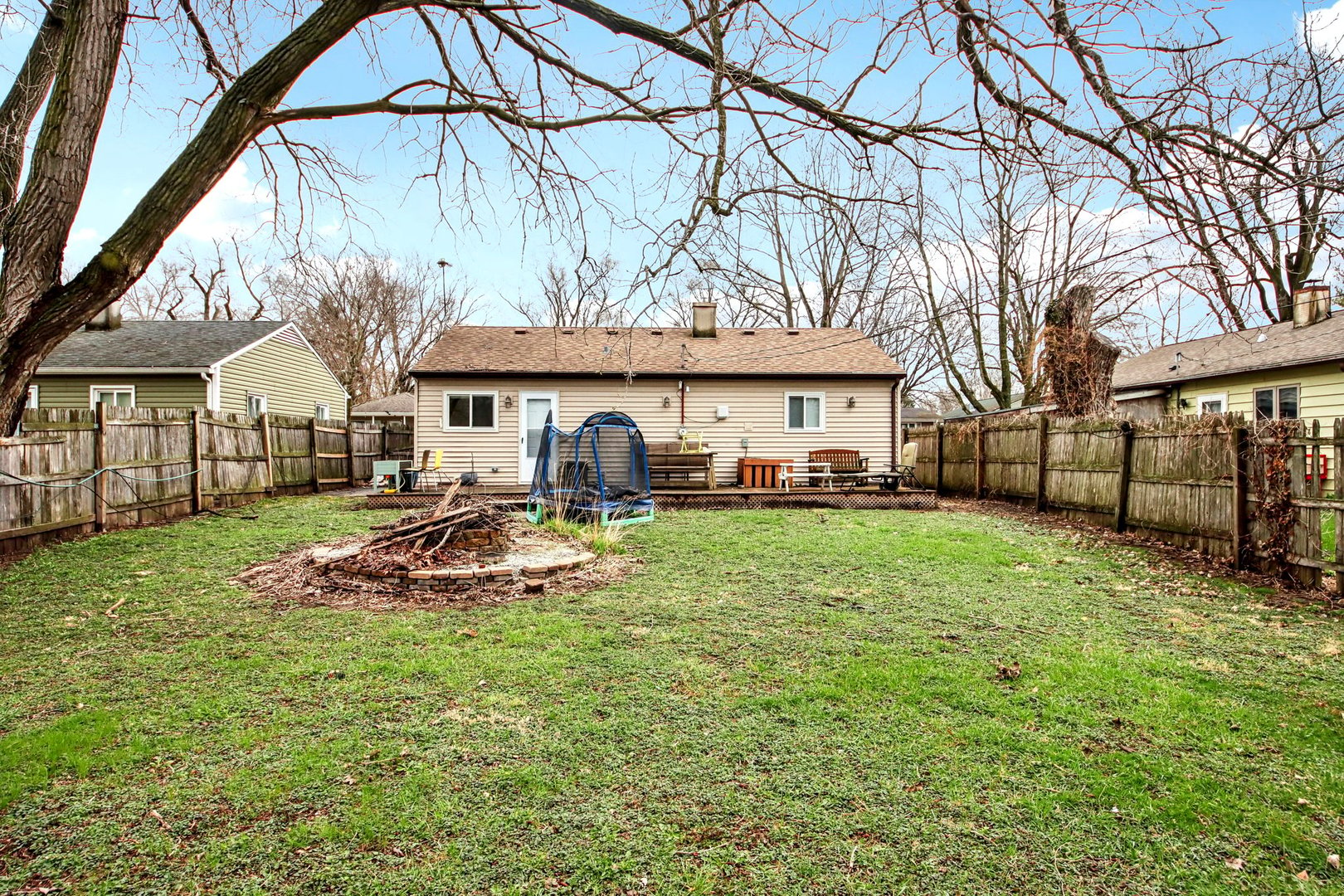 65 Della Street Crystal Lake, IL 60014 - Photo 27 of 28 a view of a house with a yard patio and fire pit