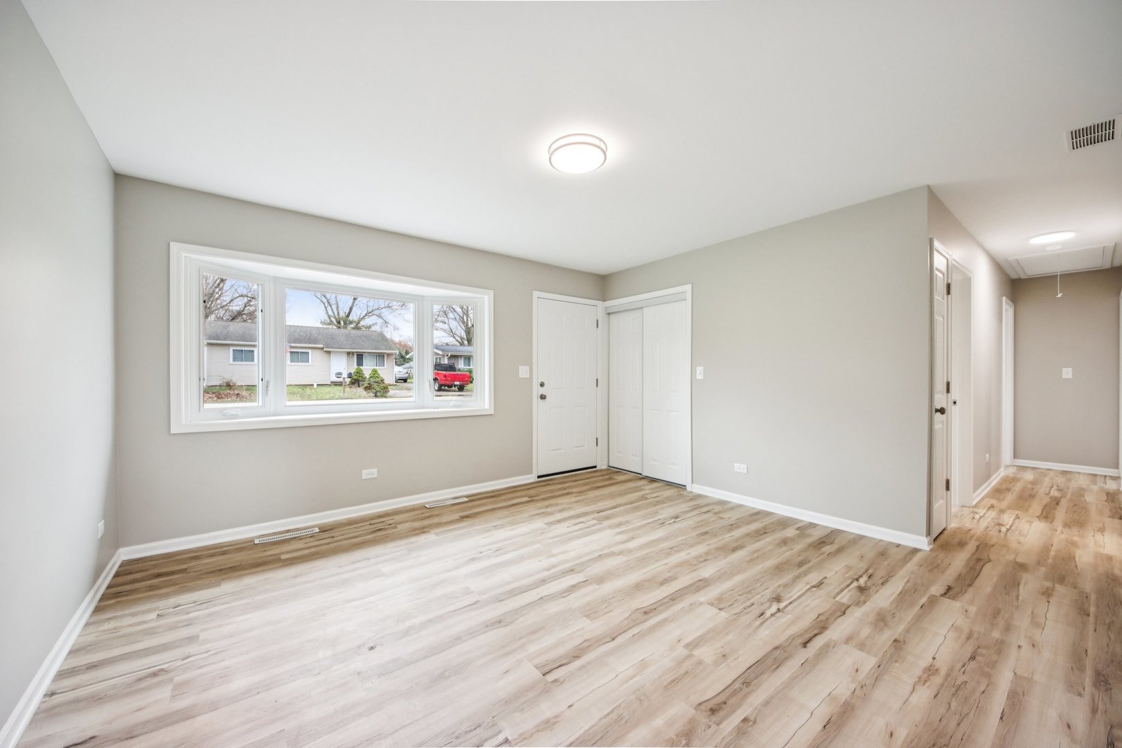 65 Della Street Crystal Lake, IL 60014 - Photo 3 of 28 a view of room with window and wooden floor