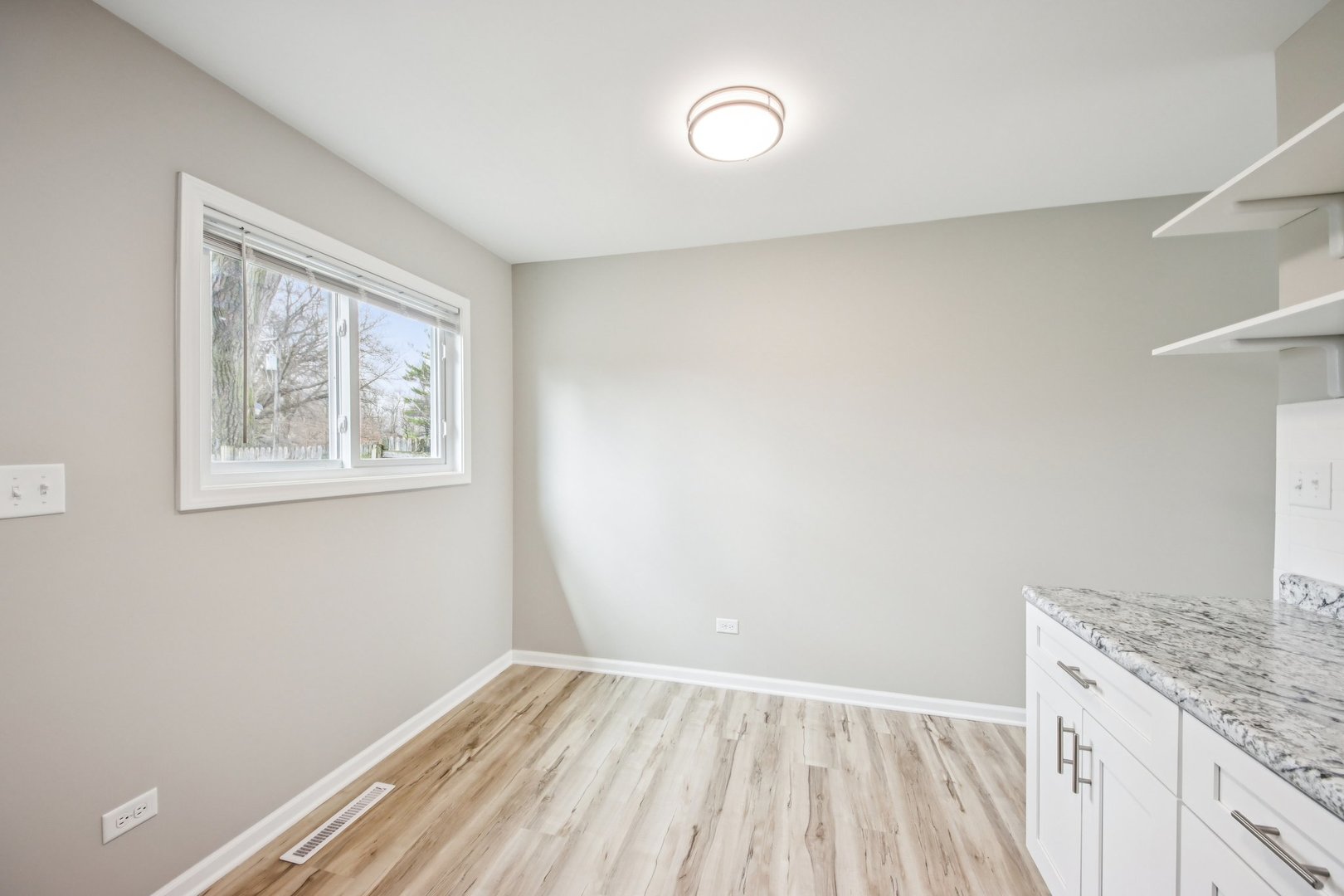 65 Della Street Crystal Lake, IL 60014 - Photo 8 of 28 a view of room with window and wooden floor