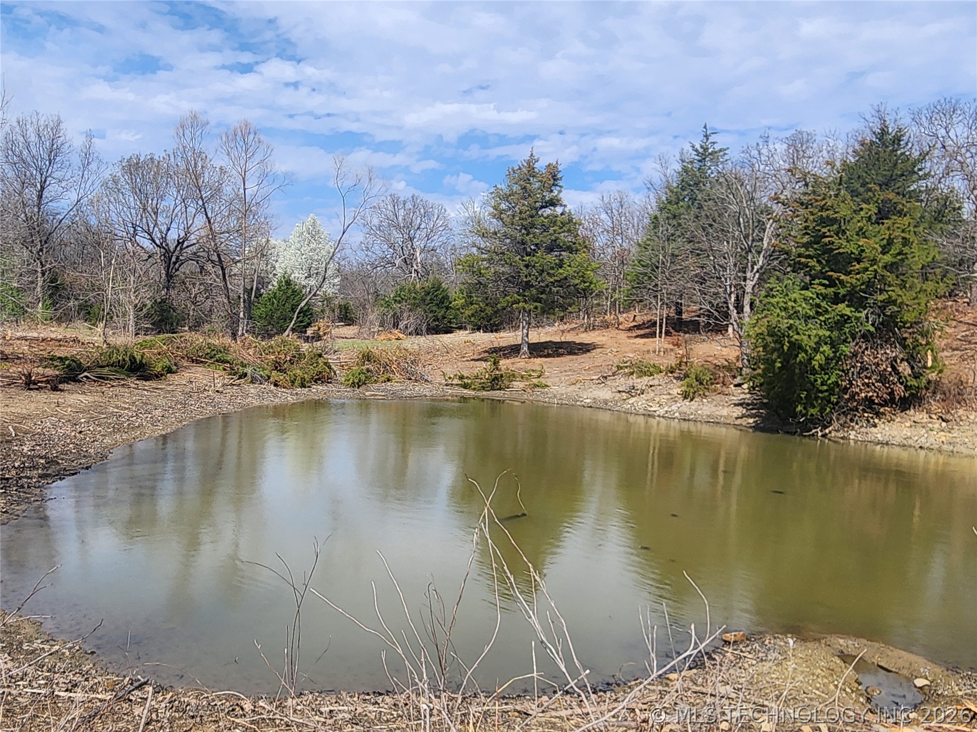 57334 South 36730th Road Terlton, OK 74081 - Photo 19 of 23 Pond over flows and runs into a creek on the property.