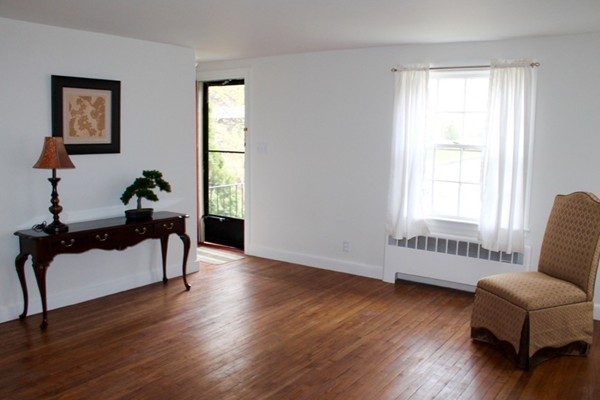 4 Carl Road Lexington, MA 02420 - Photo 3 of 18 a living room with furniture and a window