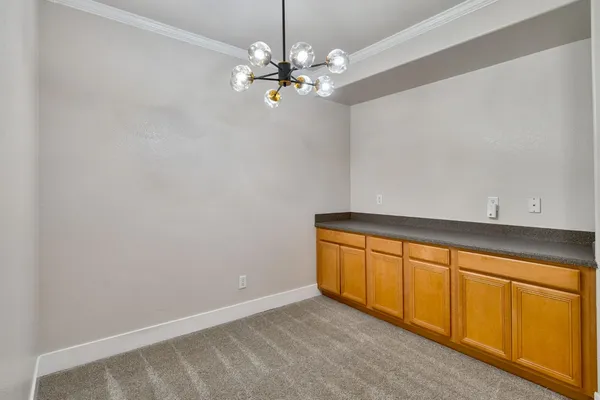 a utility room with a sink and washing machine