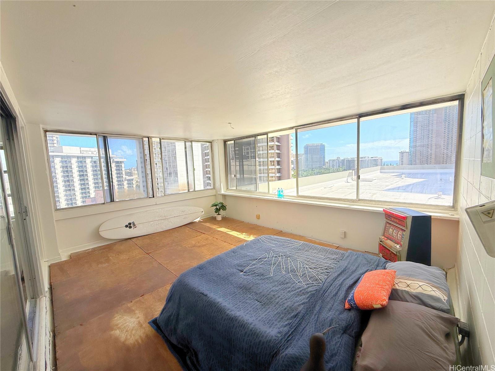 a bed sitting in a bedroom next to a window