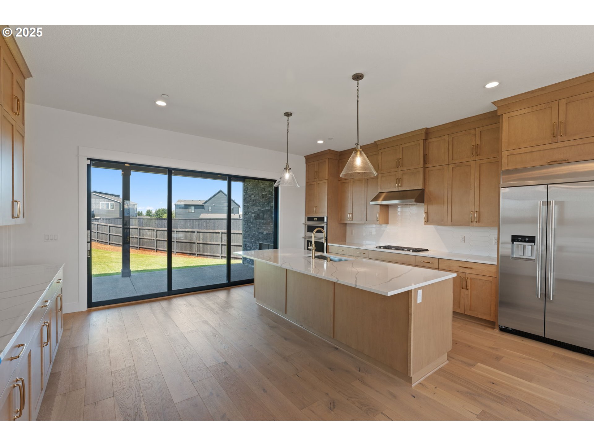 382 West Fir Loop Washougal, WA 98671 - Photo 14 of 47 a large kitchen with stainless steel appliances a large counter top a stove a refrigerator a sink and a large window