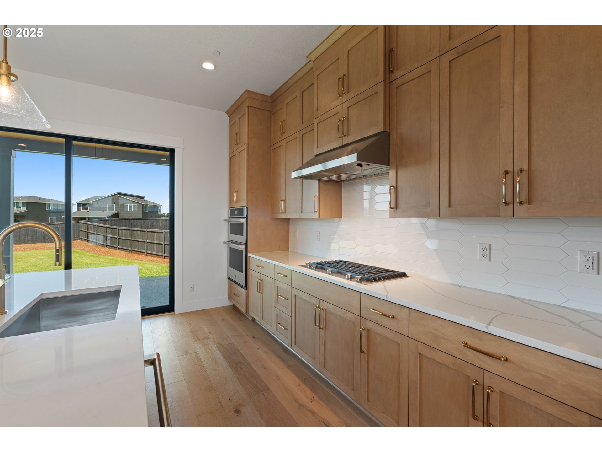 382 West Fir Loop Washougal, WA 98671 - Photo 16 of 47 a kitchen with stainless steel appliances granite countertop a stove a sink and a microwave