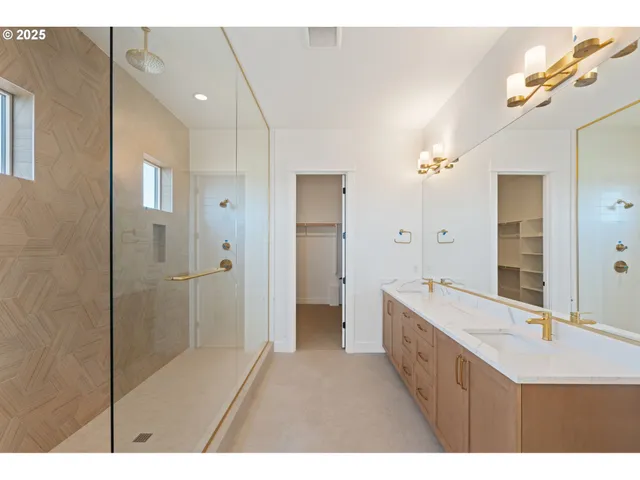 a bathroom with a sink a shower and a mirror