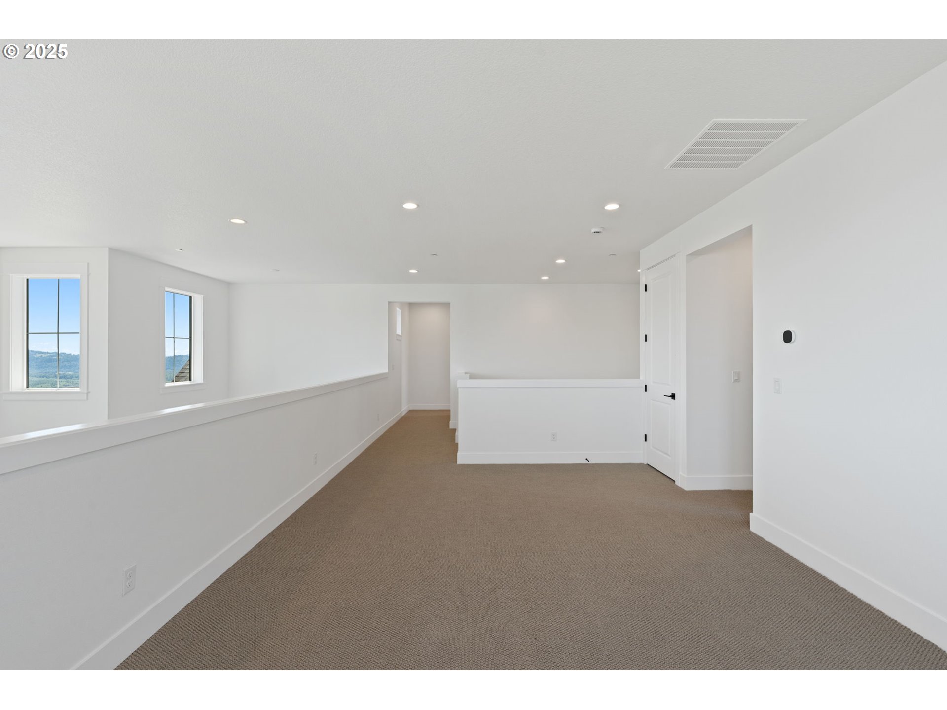 382 West Fir Loop Washougal, WA 98671 - Photo 30 of 47 a view of an empty room with wooden floor