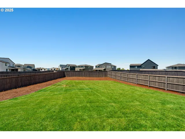 a room with lots of residential buildings and ocean view