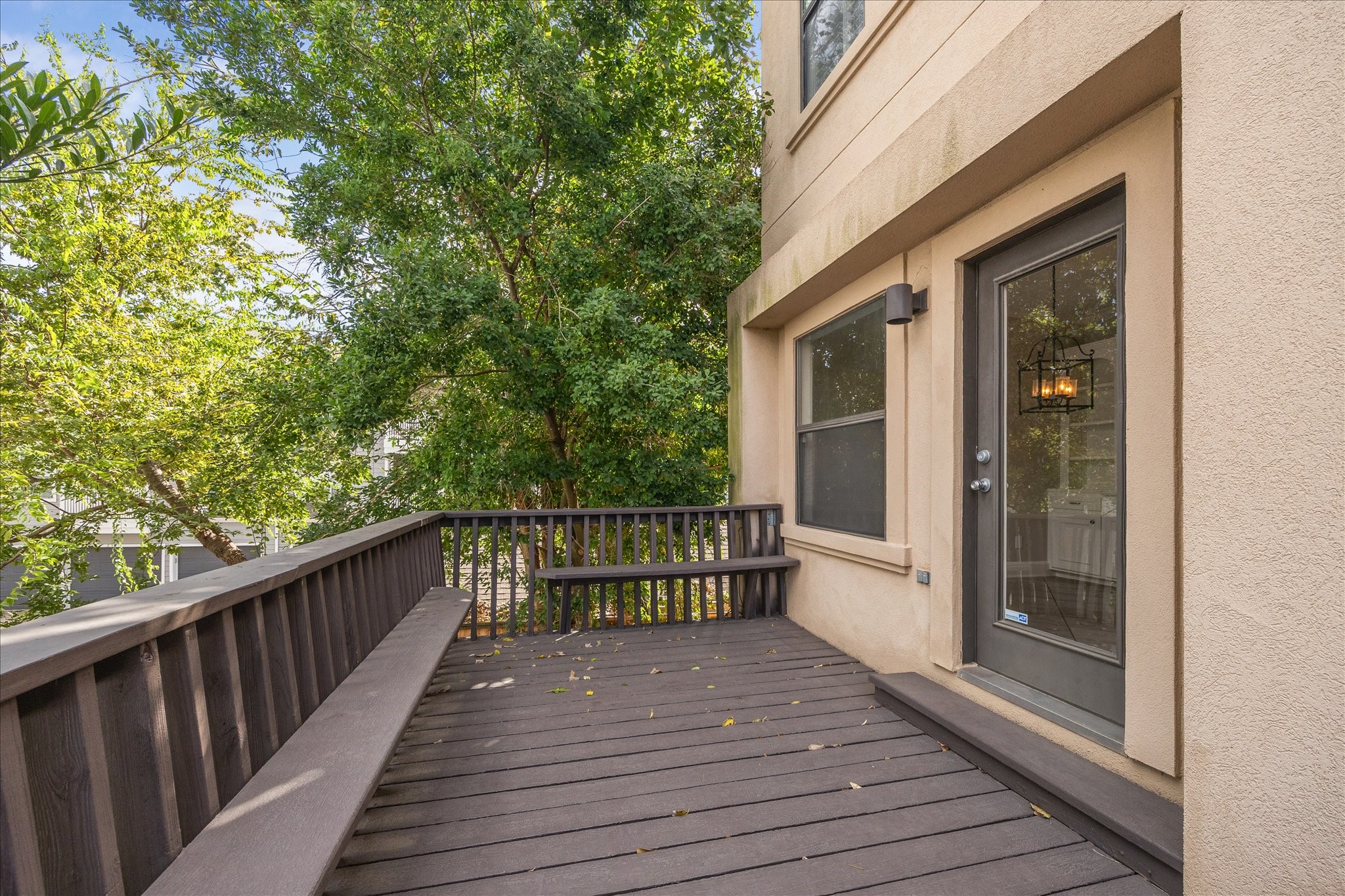 2817 Newman Street Houston, TX 77098 - Photo 19 of 36 a view of a balcony with wooden floor and iron fence