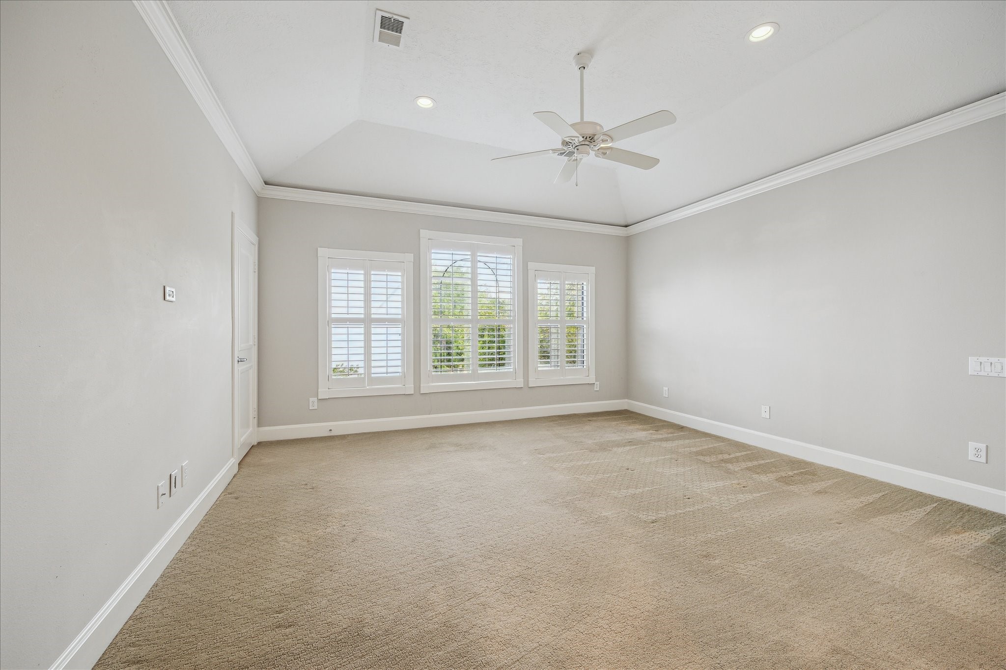 2817 Newman Street Houston, TX 77098 - Photo 21 of 36 an empty room with chandelier fan and windows