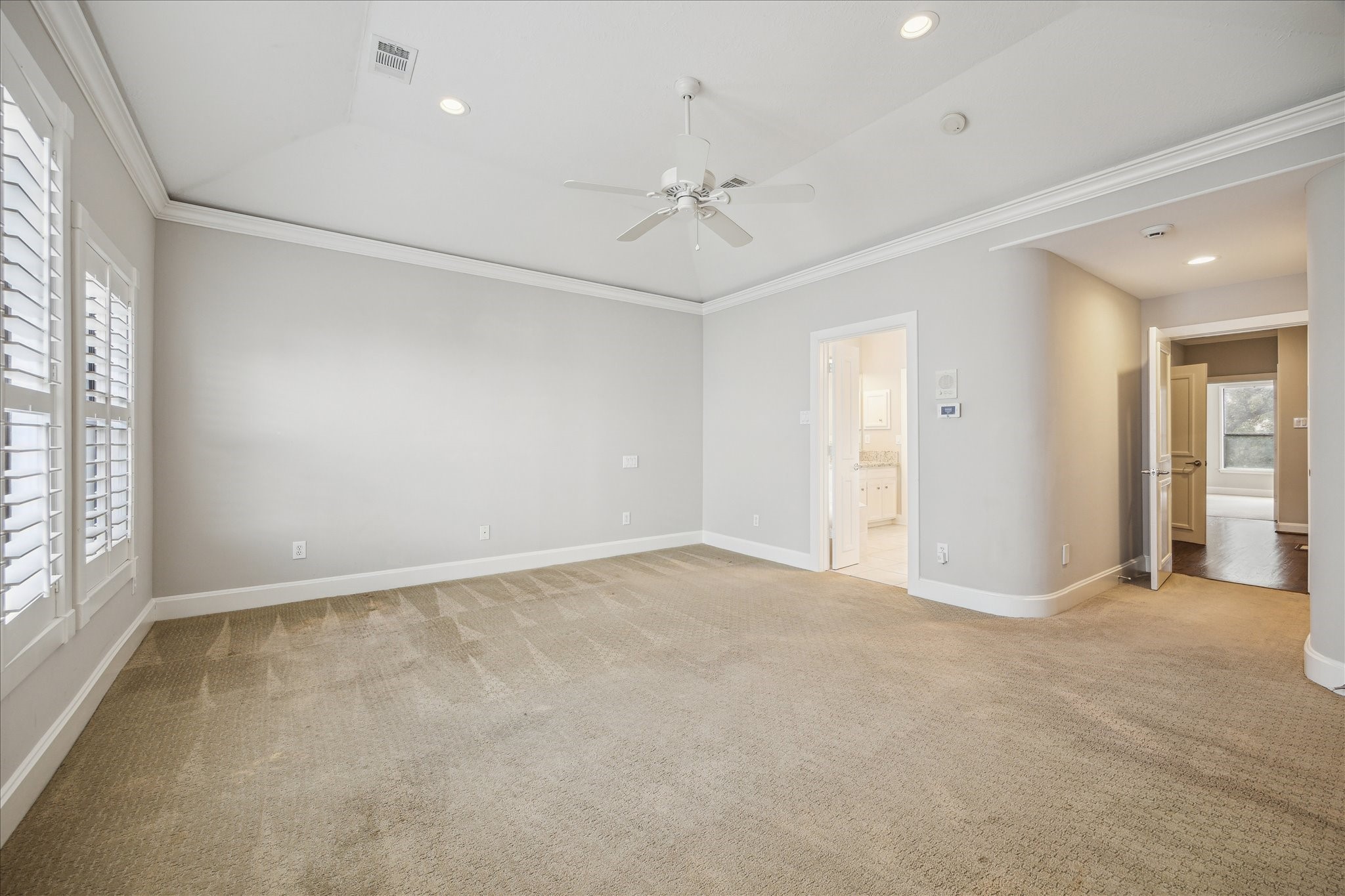2817 Newman Street Houston, TX 77098 - Photo 24 of 36 an empty room with fan and windows