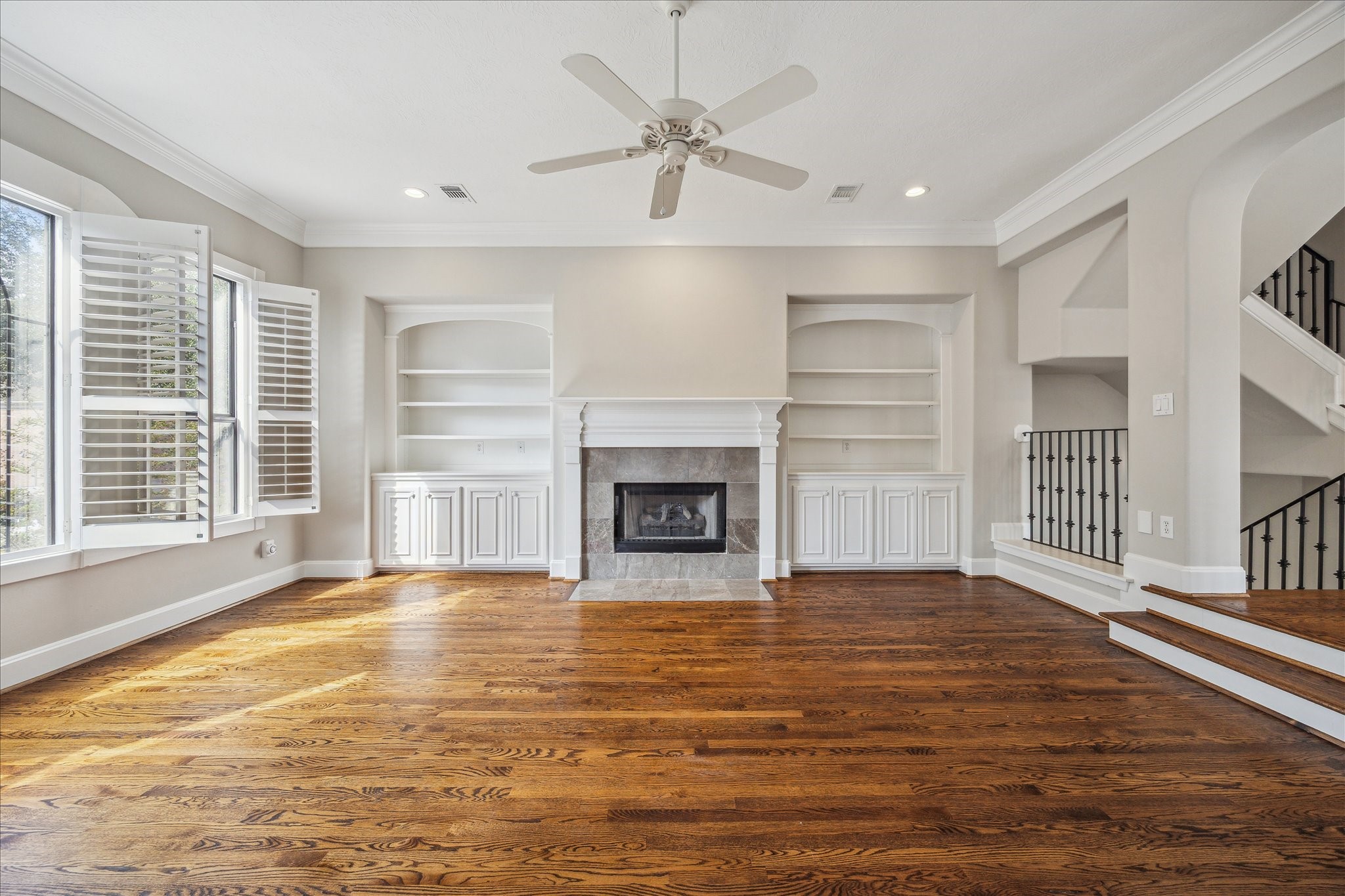 2817 Newman Street Houston, TX 77098 - Photo 10 of 36 a view of an empty room with a fireplace and a window