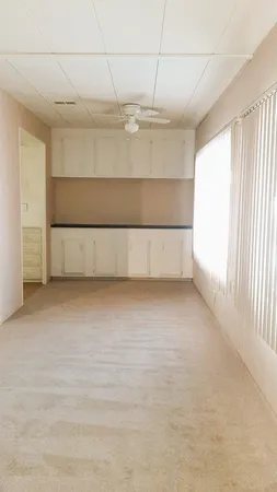 a view of a room with a hallway