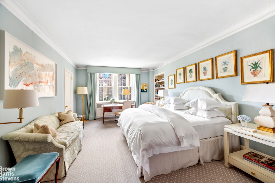 765 Park Avenue, Unit 6/7C Manhattan, NY 10021 - Photo 10 of 21 a bedroom with bed couch and window