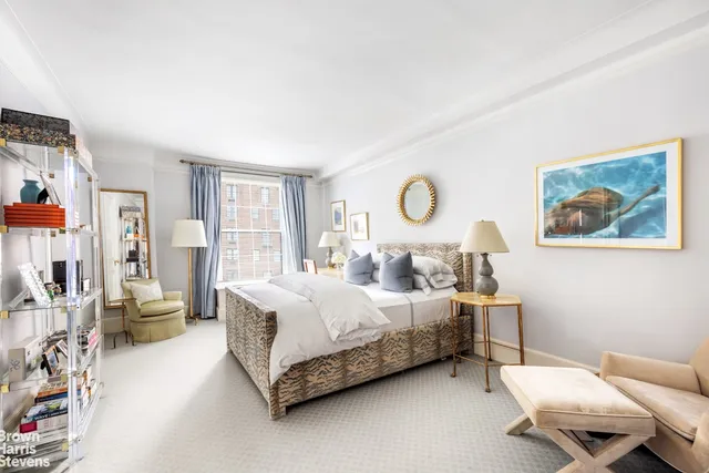 a bedroom with bed and window