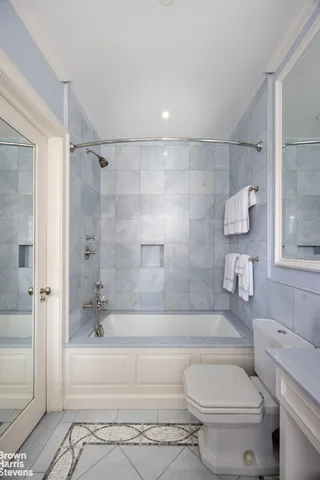 a bathroom with a toilet and a bathtub