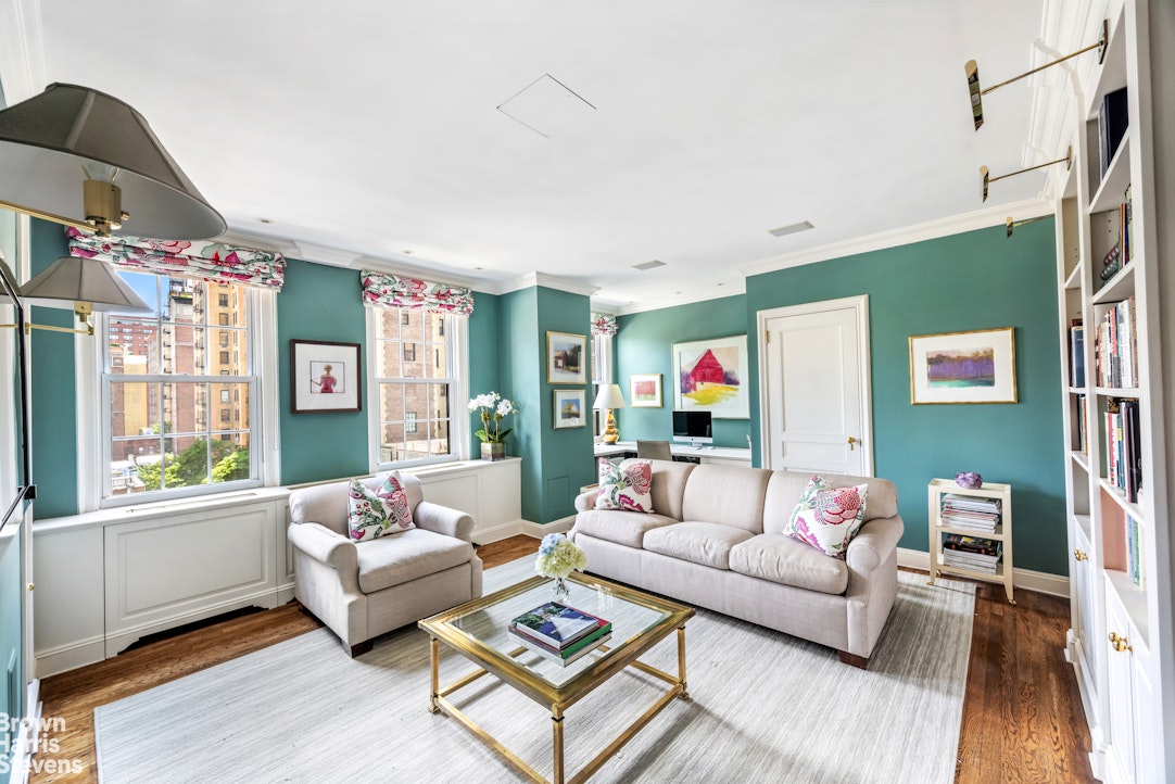 765 Park Avenue, Unit 6/7C Manhattan, NY 10021 - Photo 18 of 21 a living room with furniture and a large window