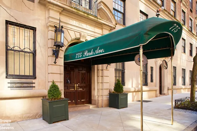 a front view of a building with outdoor space