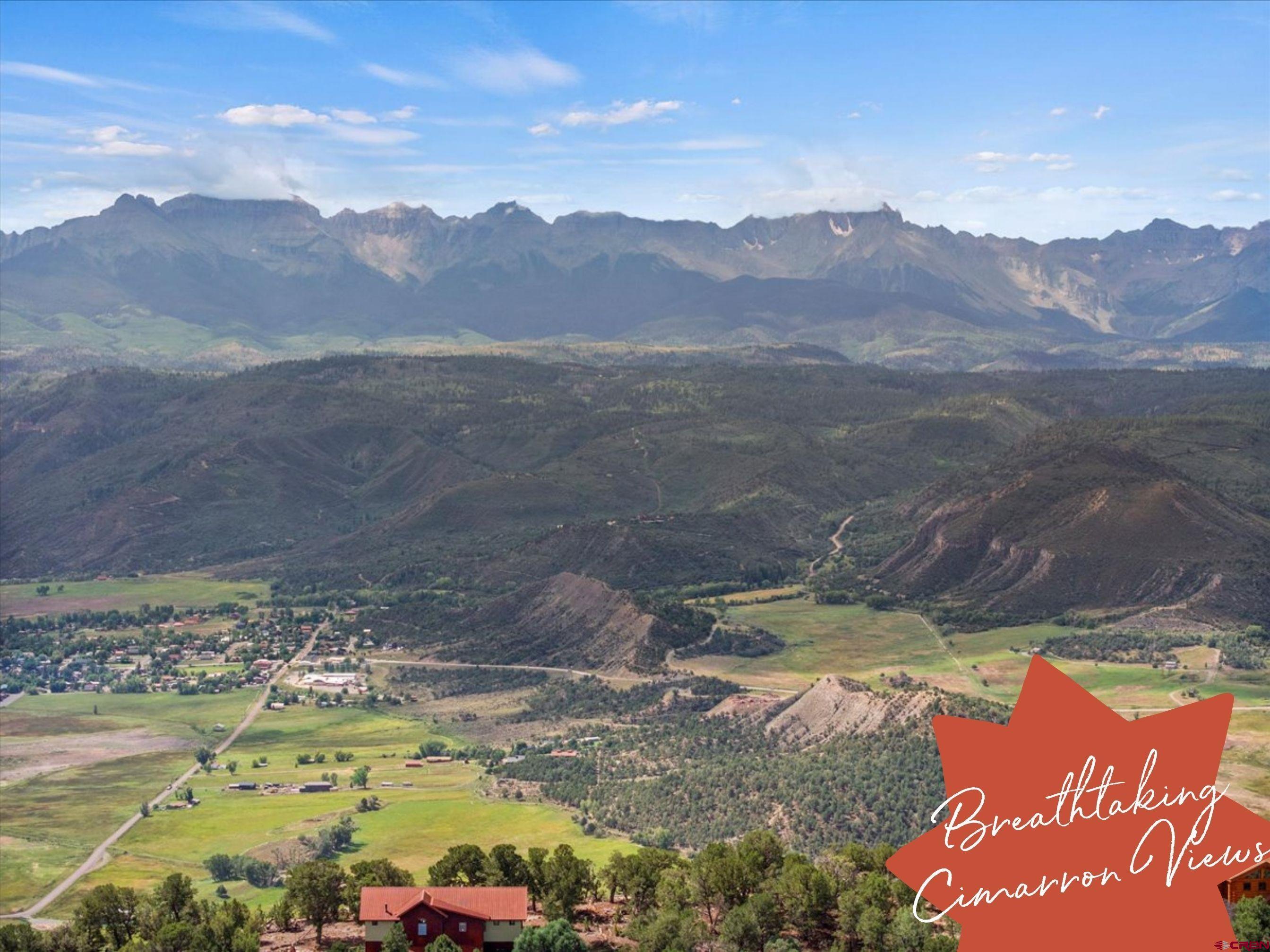 23 Pine Drive Ridgway, CO 81432 - Photo 2 of 26 a view of a lake with mountains in the background