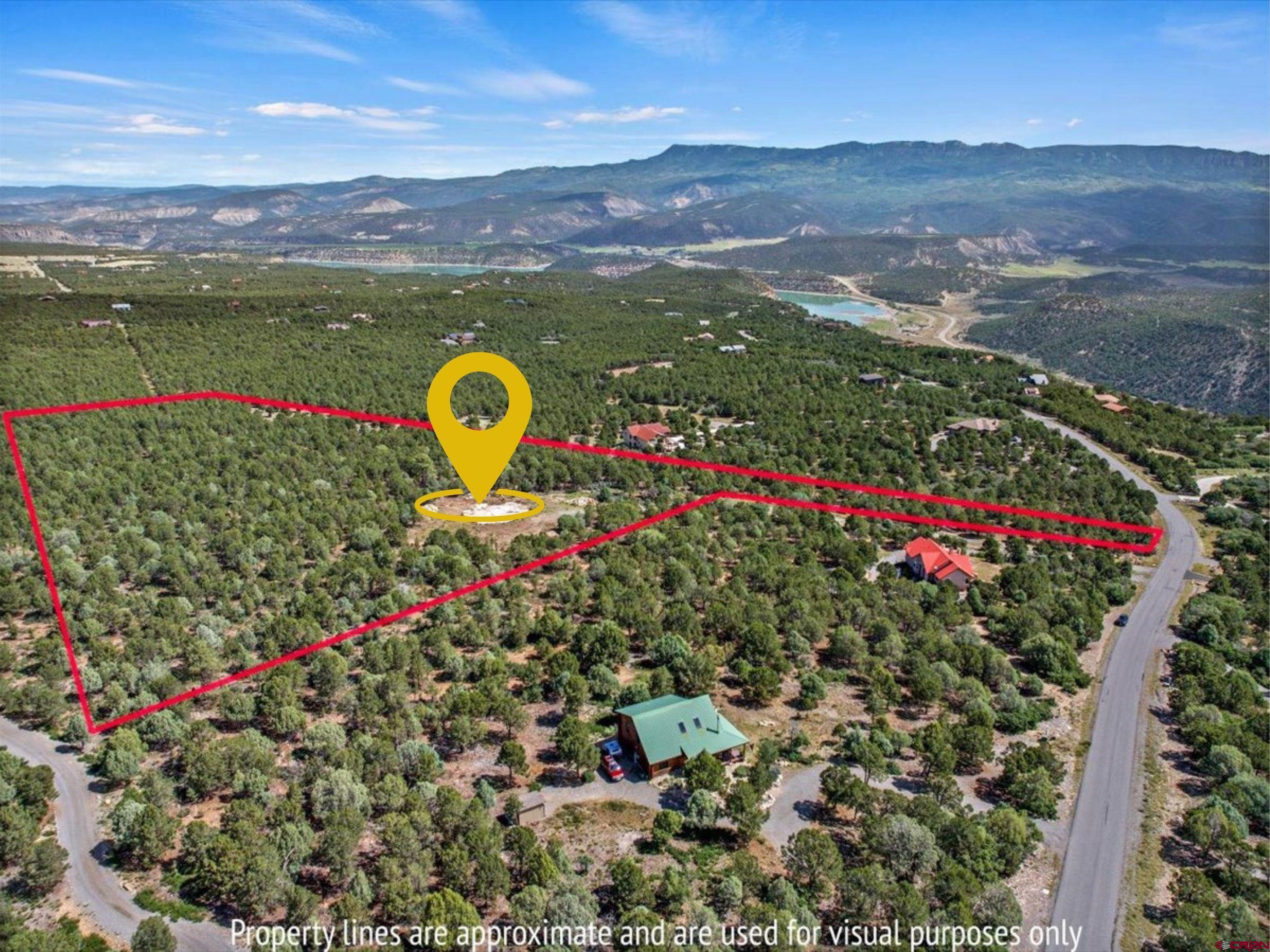 23 Pine Drive Ridgway, CO 81432 - Photo 5 of 26 a view of a lake with a mountain in the background