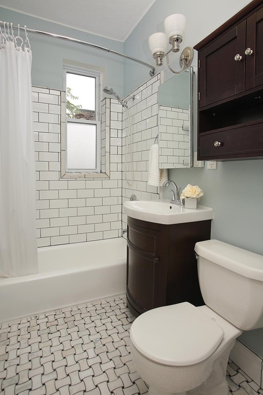 20 Winchester Street, Unit 8 Brookline, MA 02446 - Photo 8 of 8 a bathroom with a sink toilet and shower