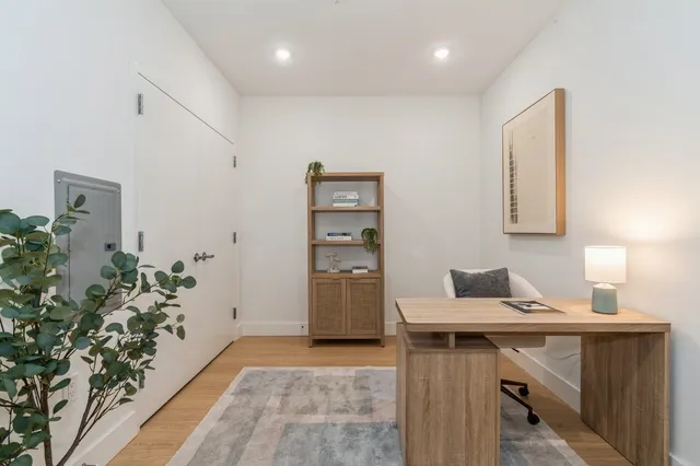 a utility room with cabinets washer and dryer