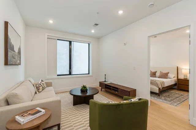 a bedroom with bed and window