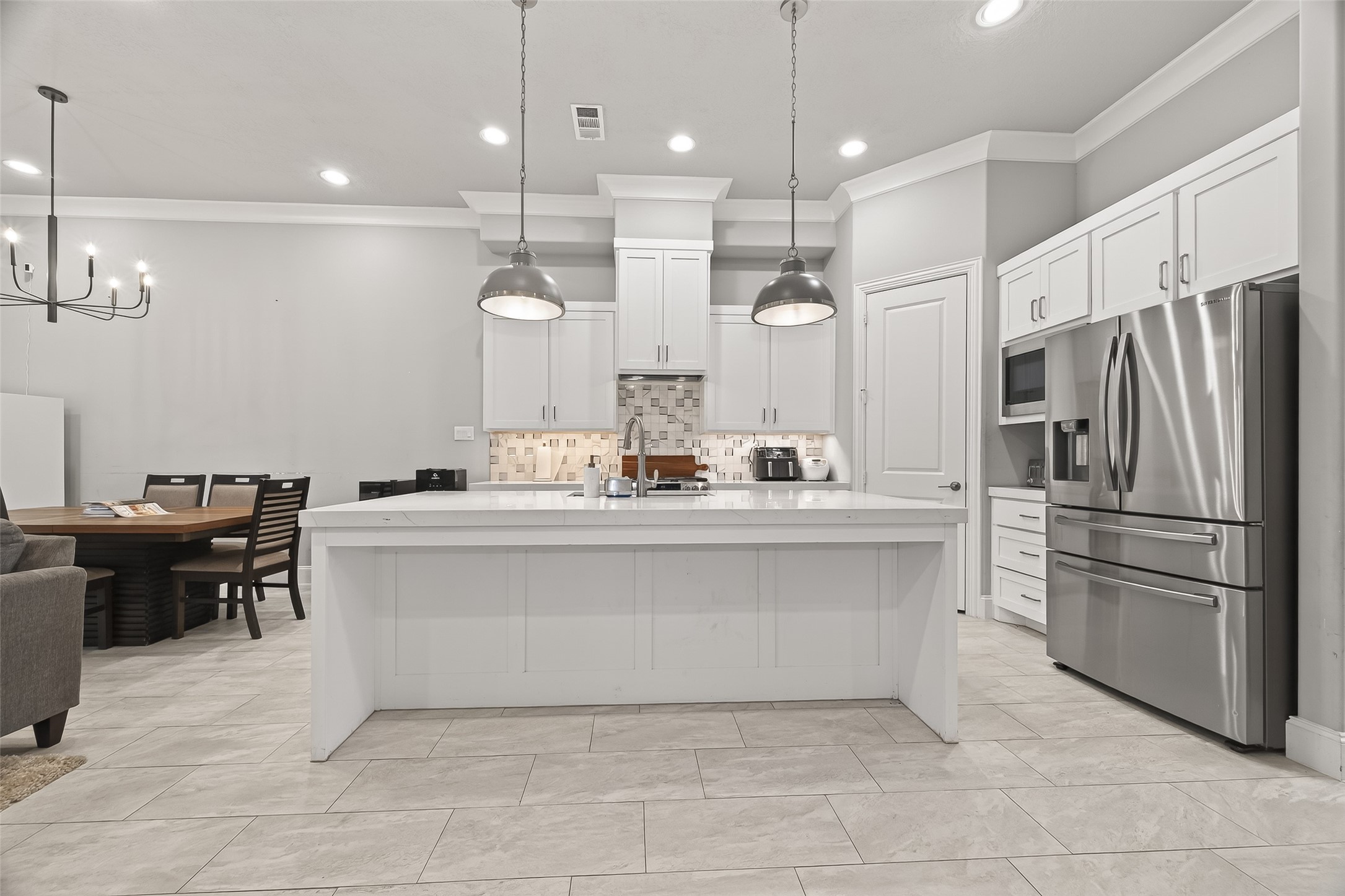 2435 Prairie Hollow Lane Houston, TX 77077 - Photo 19 of 50 a kitchen with kitchen island a sink stainless steel appliances and cabinets