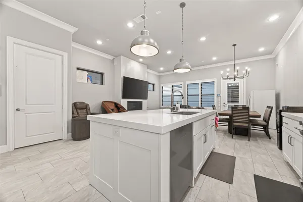 a kitchen with stainless steel appliances a refrigerator and cabinets