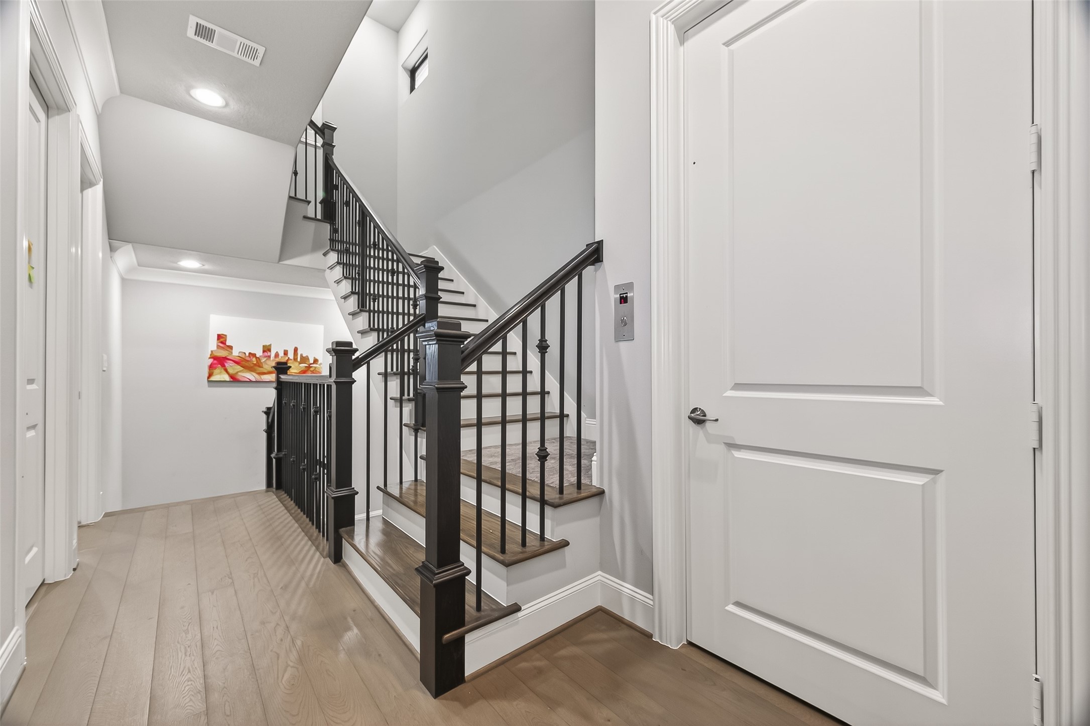 2435 Prairie Hollow Lane Houston, TX 77077 - Photo 25 of 50 a view of entryway with stairs and wooden floor