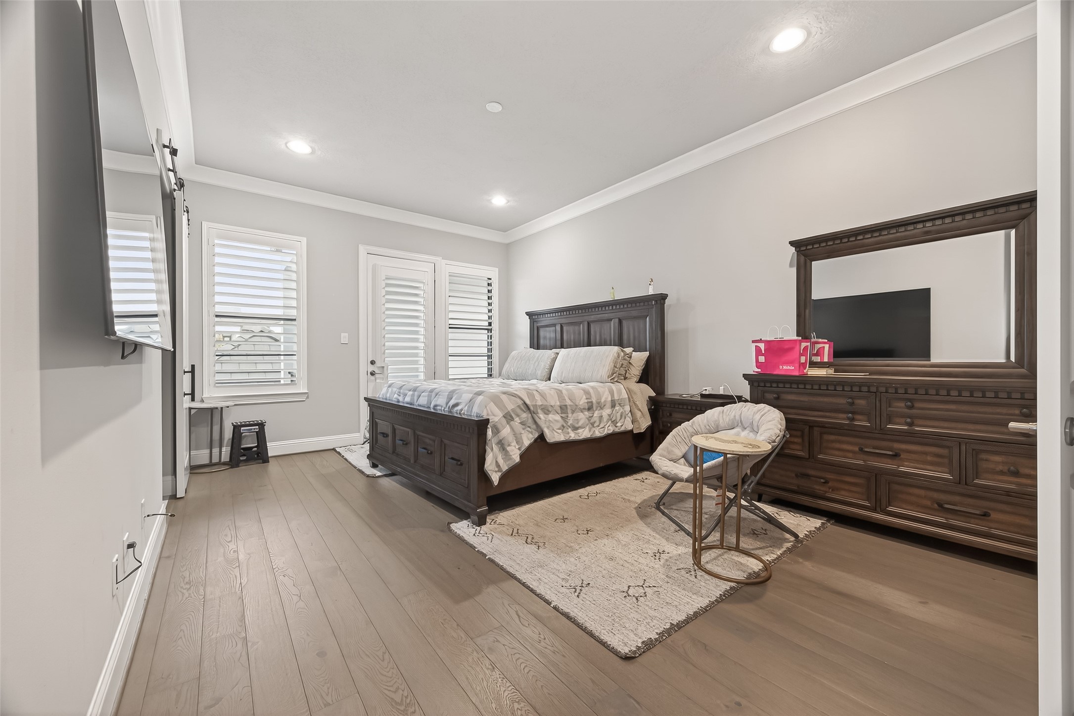 2435 Prairie Hollow Lane Houston, TX 77077 - Photo 26 of 50 a bedroom with furniture and a flat screen tv