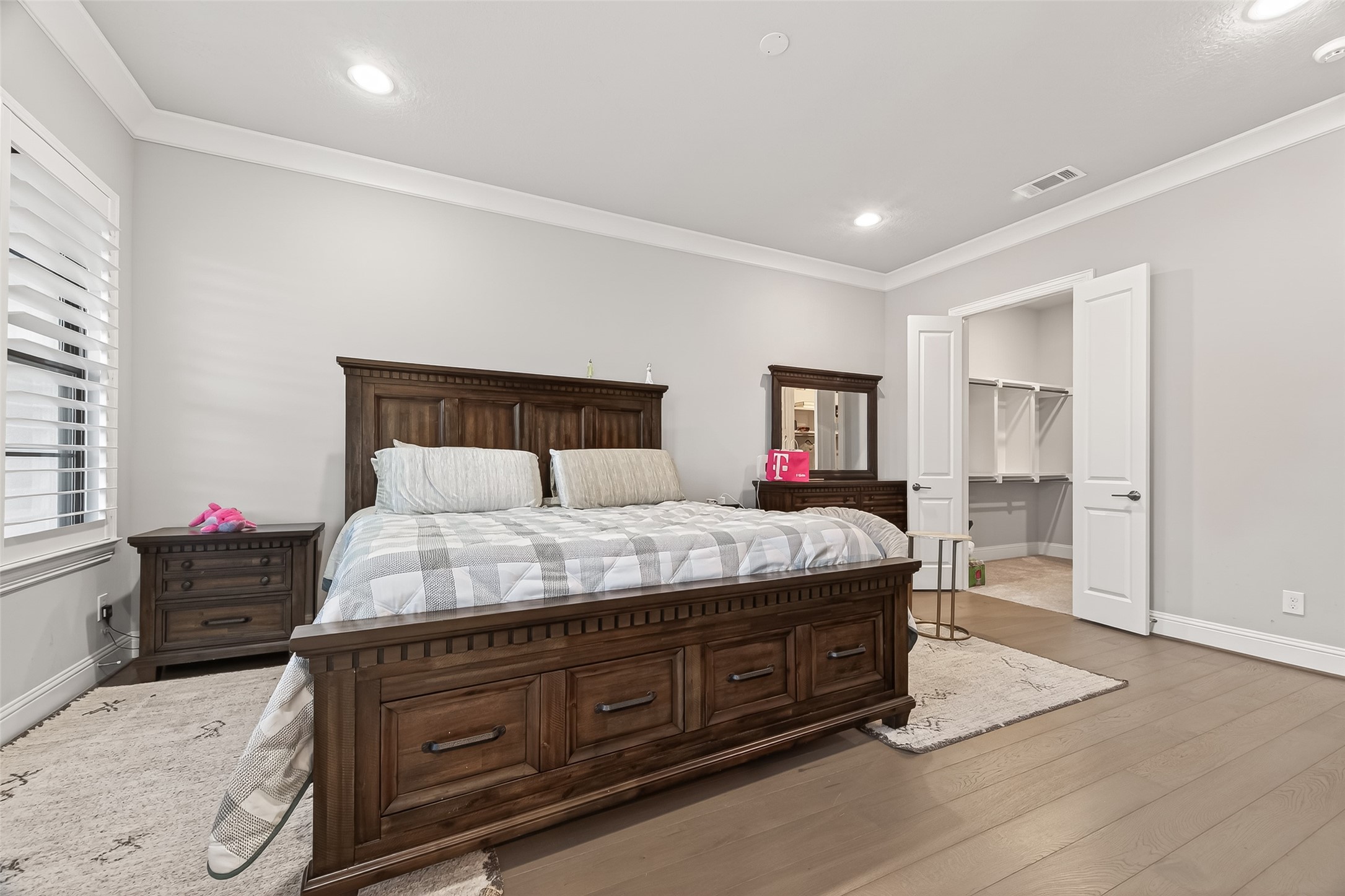 2435 Prairie Hollow Lane Houston, TX 77077 - Photo 27 of 50 a bedroom with a bed and wooden floor