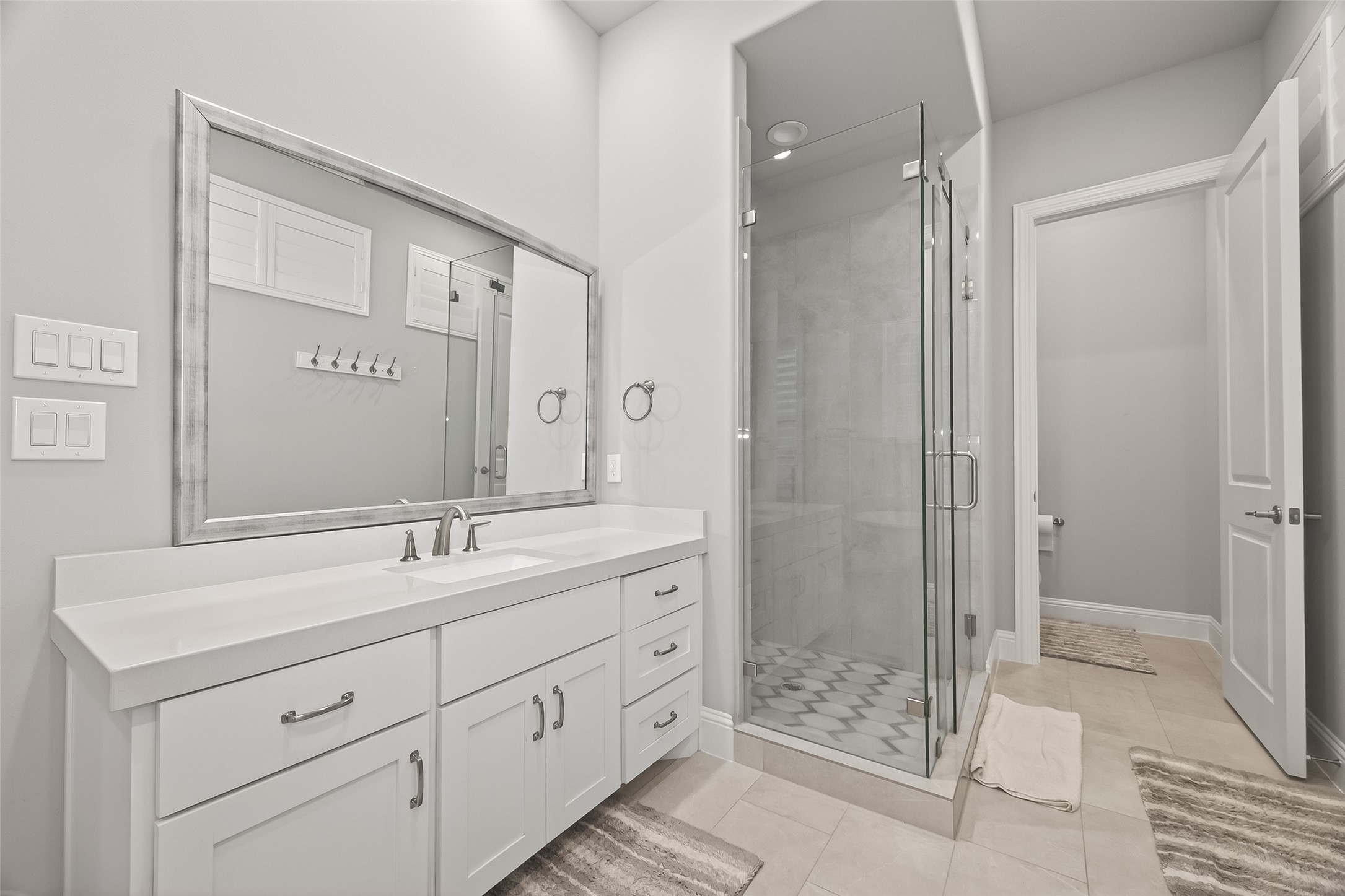 2435 Prairie Hollow Lane Houston, TX 77077 - Photo 30 of 50 a bathroom with a shower sink and mirror